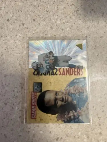 Deion Sanders football card from 1995 Pinnacle Barry Sanders Clear Shots Insert