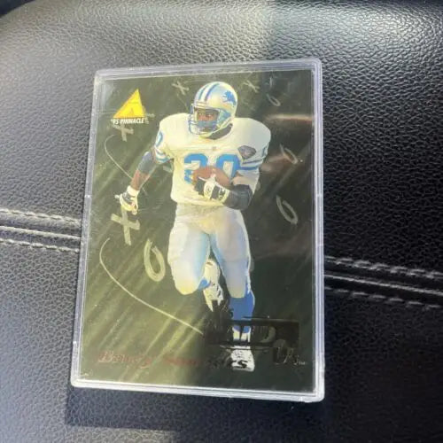 Football trading card in protective case featuring Barry Sanders NFL Detroit Lions