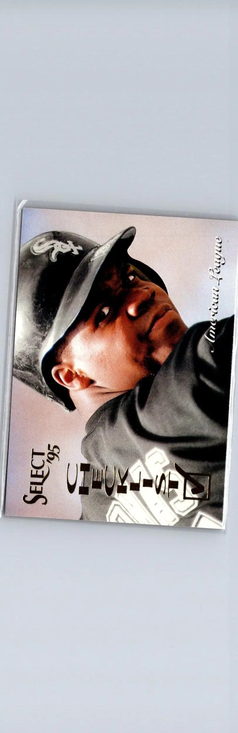 Baseball trading card featuring a player in black cap and shirt from 1995 Select American League Checklist