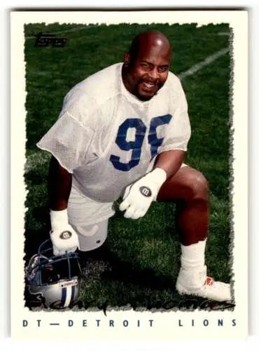Football player kneeling, featured in 1995 Topps #291 Henry Thomas Detroit card