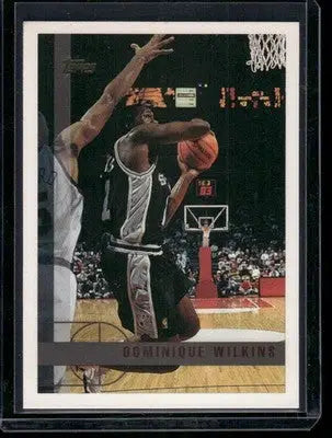 Basketball trading card featuring Dominique Wilkins from 1996-97 Topps Dominique Wilkins series