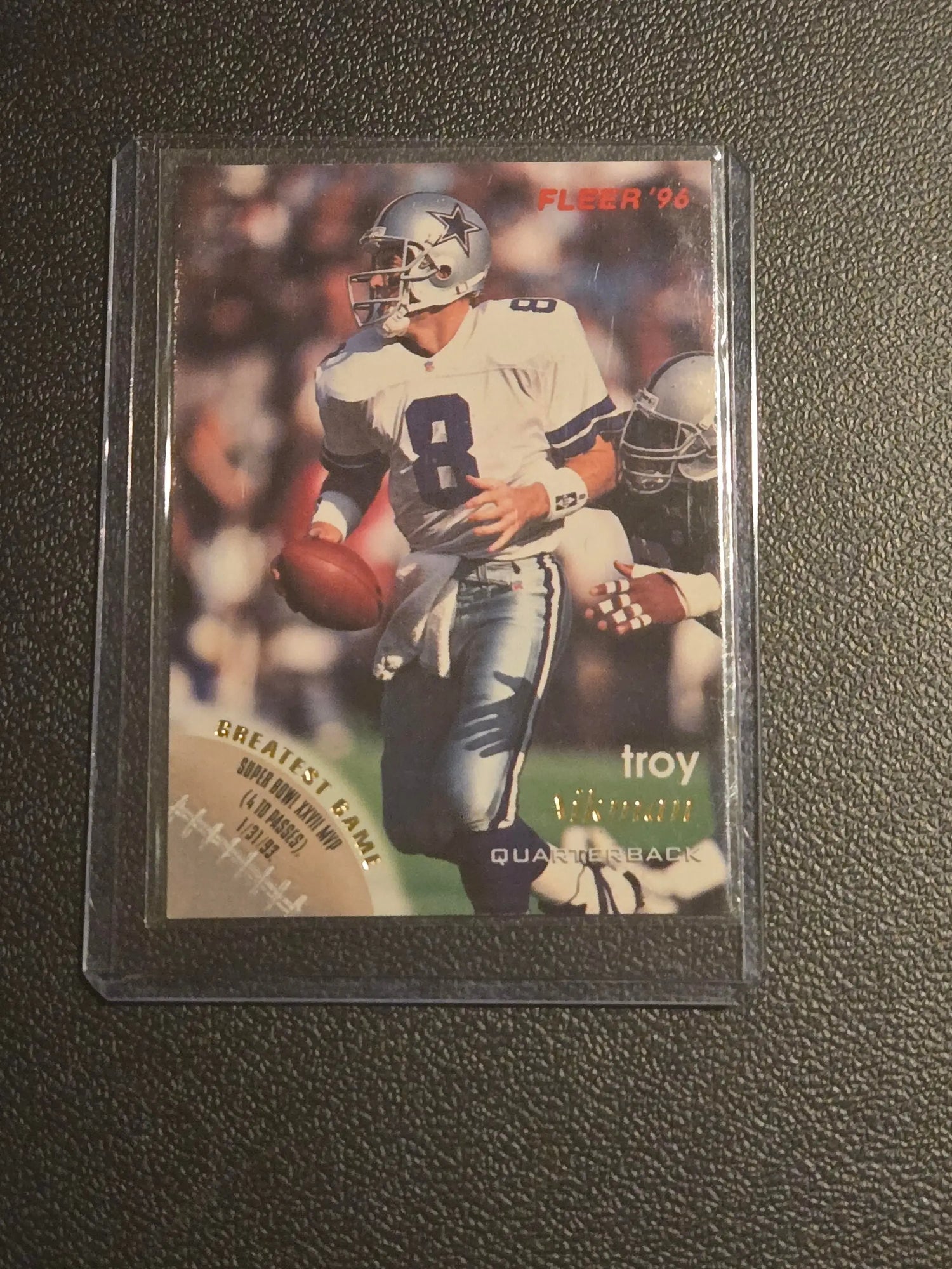 Collectible 1996 Fleer Troy Aikman football trading card in Dallas Cowboys uniform