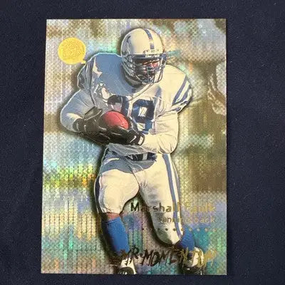 Football trading card of Marshall Faulk in a white and blue uniform with Light Blue Pulsar design from Fleer Ultra