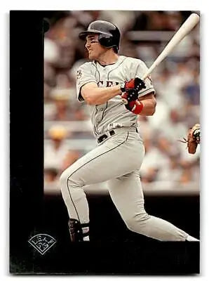 Tim Salmon swinging bat in 1996 Leaf #45 baseball trading card collectible