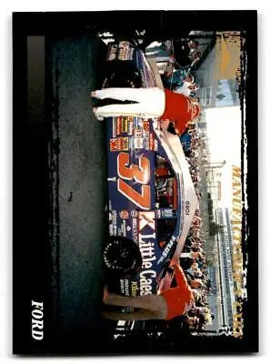 Race car with pit crew featured on 1996 Pinnacle Racer’s Choice #76 Ford trading card