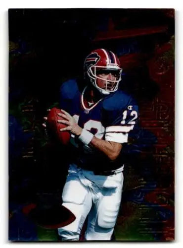 Football player in uniform holding ball from original gloss Jim Kelly Buffalo Bills card