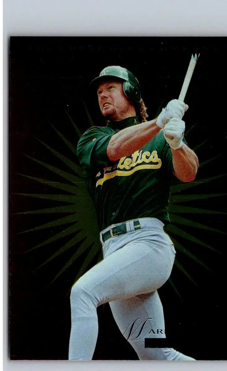 Baseball player in green and gold uniform swinging bat, 1996 Upper Deck Mark McGwire card