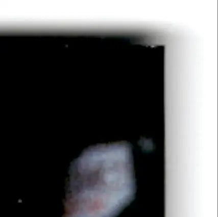 Close-up of blurred object on black background with white border for 1996 Upper Deck Racing Road to the Cup Brett Bodine #RC19a