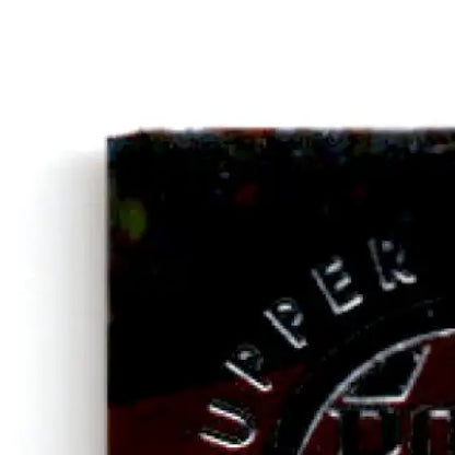 Dark rectangular Upper Deck Racing object with embossed UPPER for 1996 Cup Hut Stricklin