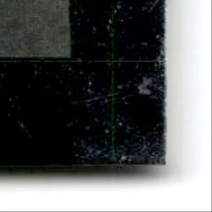 Scratched textured black surface with faint green line from 1996 Upper Deck Racing Cup Joe Nemechek