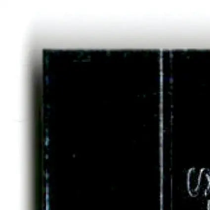 Dark glossy section of 1996 Upper Deck Racing Road to the Cup Steve Grissom RC25a card with scratch and dust