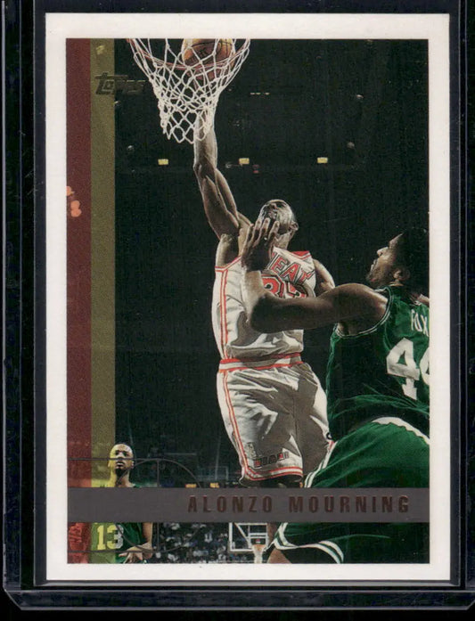 Vintage Topps Alonzo Mourning basketball trading card showing him shooting over an opponent