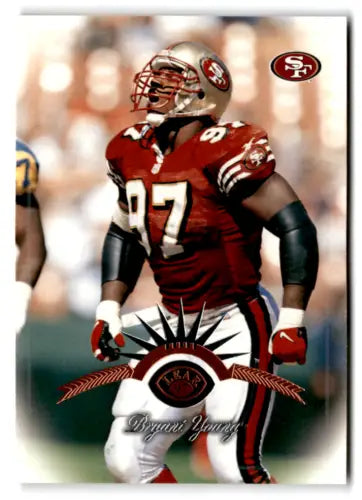 Football player in uniform showcasing original gloss 1997 Leaf Bryant Young card