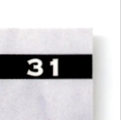 White fabric swatch with black label for Leaf Cris Carter 1997 Leaf Cris Vikings product