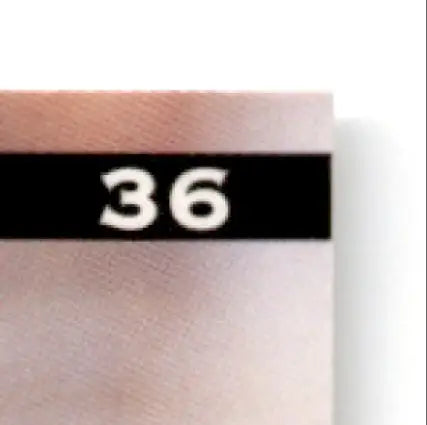 Leaf football Ben Ben Coates #36 featuring a light brown rectangular object with black stripe