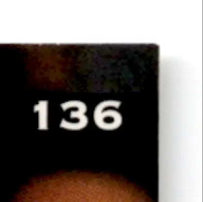 Partially visible black Leaf Football Darick Holmes #136 Buffalo Bills collectible card