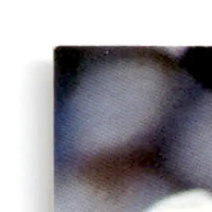 Close-up of a blurred silver-gray metallic surface for Leaf Football Daryl Johnston #143 Dallas Cowboys