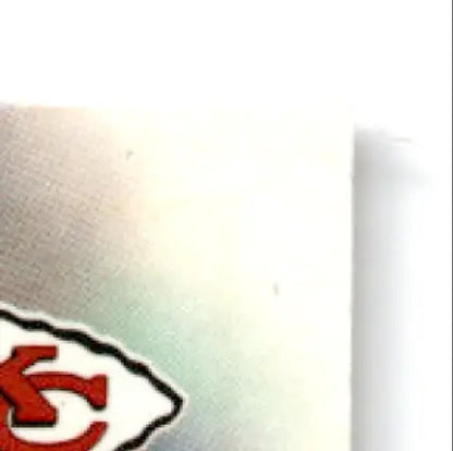 Partial view of Kansas City Chiefs logo on light surface for 1997 Leaf Football Kimble Anders
