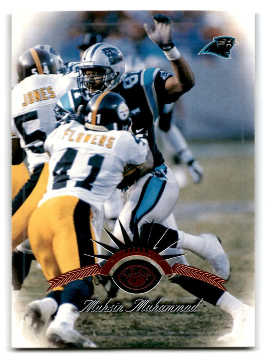 Football trading card featuring Muhsin Muhammad in action from 1997 Leaf Football collection