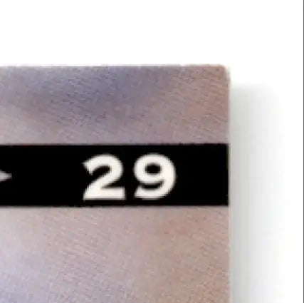 Top right corner of wooden board with 29 on black strip from Leaf Football Rodney Hampton card