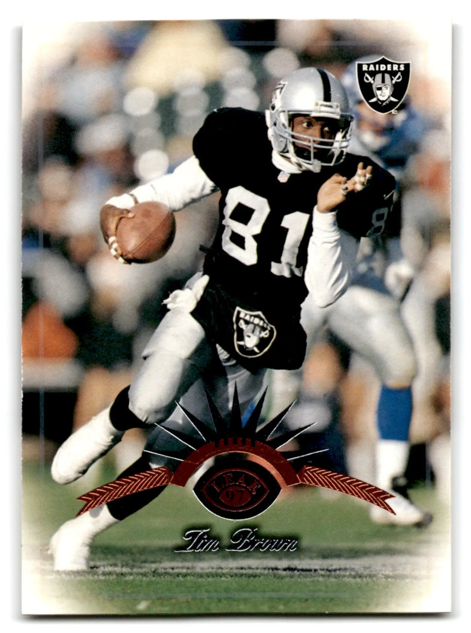 1997 Leaf Football Tim Brown #144 Oakland Raiders trading card featuring Tim Brown in action