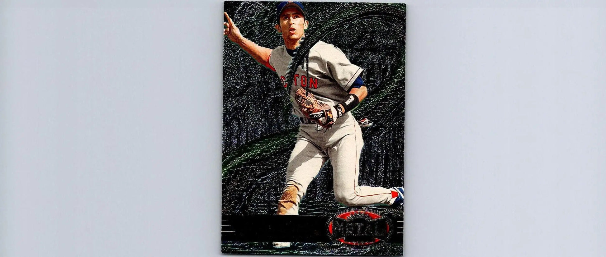 1997 Metal Universe #21 Nomar Garciaparra baseball card featuring player throwing