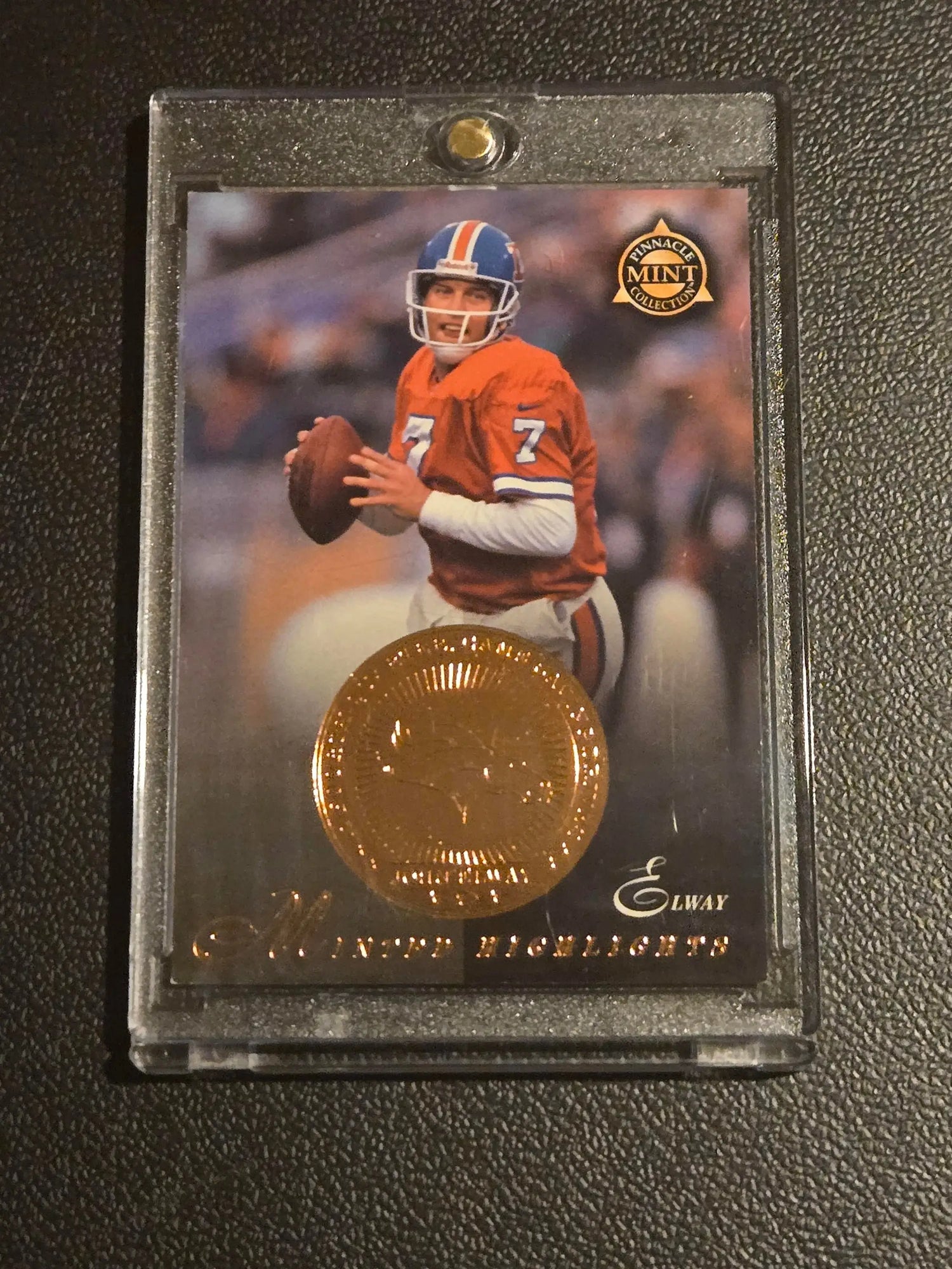 John Elway Pinnacle Mint trading card with bronze coin in plastic case