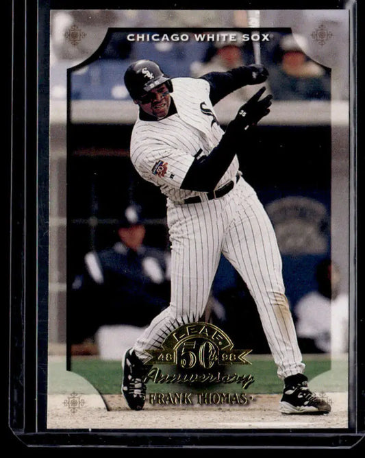 Baseball card of Frank Thomas NM-MT in pinstriped uniform swinging bat