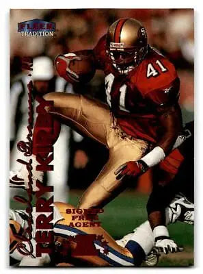 Terry Kirby in action on 1999 Fleer Tradition trading card showcasing football skills