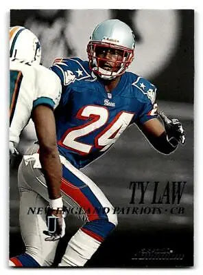 Football player in action from 1999 SkyBox Dominion trading cards featuring Ty Law