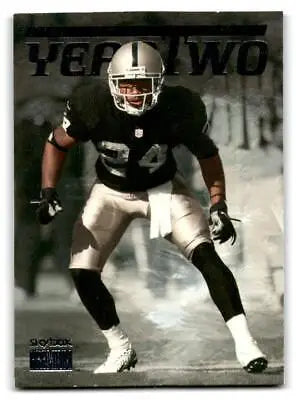 Football player in action showcasing Charles Woodson Year Two collectible card