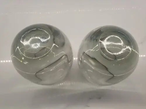Smoke gray glasses featuring two gray marbled spheres celebrating Dallas Cowboys world champions