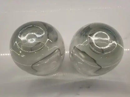 Smoke gray glasses featuring two gray marbled spheres celebrating Dallas Cowboys world champions