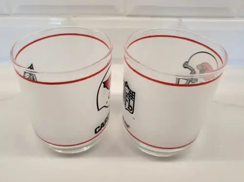 Two vintage NFL Mobil St. Louis Cardinals glasses displayed in mint condition