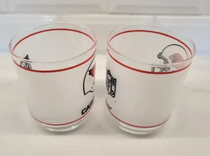 Two vintage NFL Mobil St. Louis Cardinals glasses displayed in mint condition