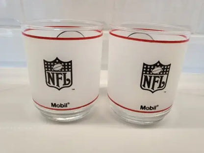 Two Vintage NFL Mobil glasses featuring the St. Louis Cardinals design
