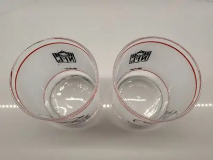 Two Vintage NFL Mobil drinking glasses featuring the St. Louis Cardinals logo