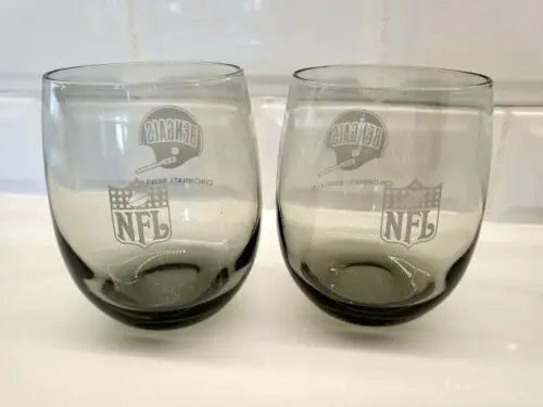 Two gray smoked glass tumblers featuring the Cincinnati Bengals logo