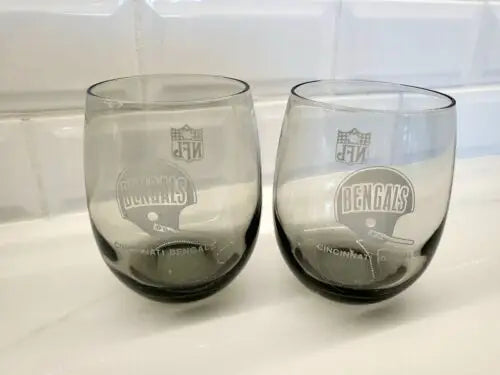 Two Cincinnati Bengals smoked glass tumblers featuring the team’s logo