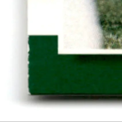 Green-bound book with white border and page edges for 2000 Score Football Jerry Rice San Francisco 49ers