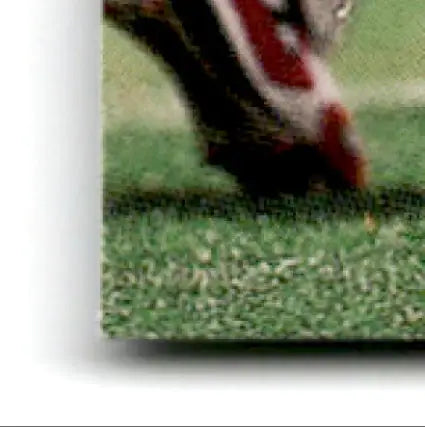 Foot in shoe on grassy field with 2000 Upper Deck Football Steve Young #183 San Francisco 49ers