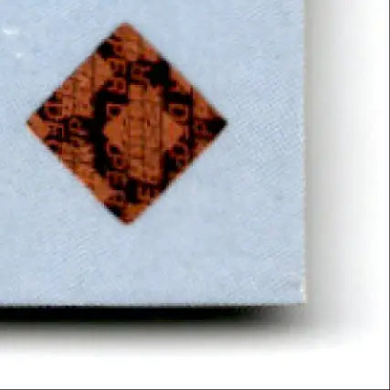 Orange diamond-shaped sticker with black text on 2000 Upper Deck Football Steve Young card