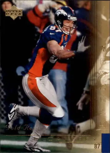 Denver Broncos player Ed McCaffrey in orange and navy running with the ball, Upper Deck Gold