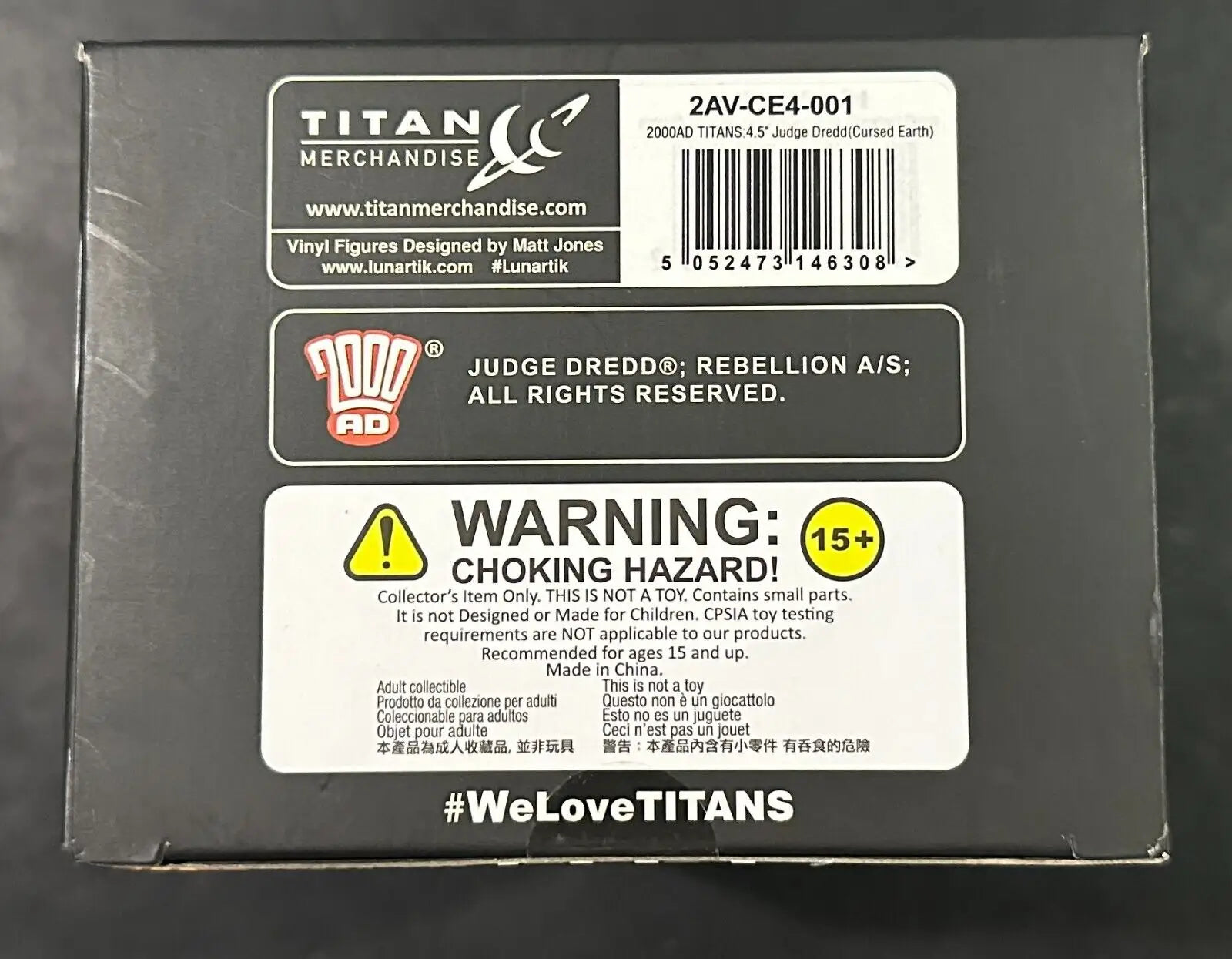 Toy packaging for 2000AD Titans Judge Dredd Cursed Earth Vinyl Figure with choking hazard warning