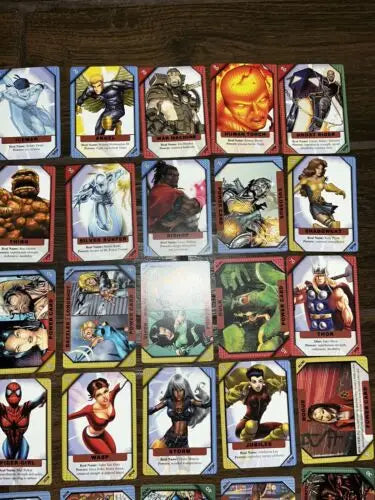 Marvel Recharge trading cards including 2 foil cards featuring Cyclops and Angel
