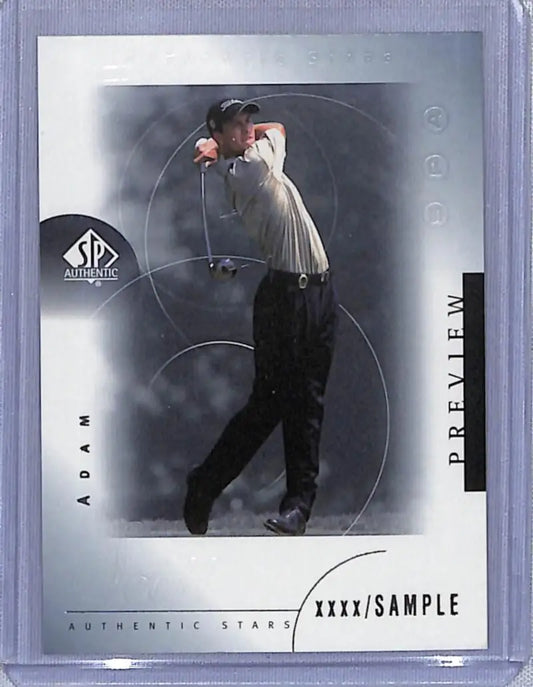Golf card featuring Adam Scott mid-swing in black pants and white shirt by Upper Deck