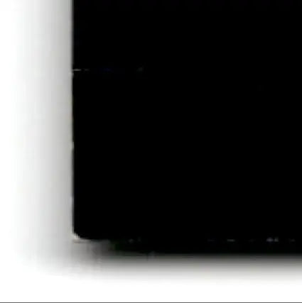 Bottom-left corner of a solid black object from 2002 Playoff Football Prestige Jerry Rice #104 Oakland Raiders