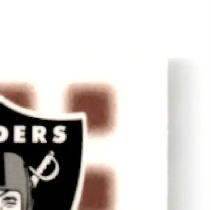 Partial view of black and white NFL team shield logo from 2002 Upper Deck Football MVP Jerry Rice card