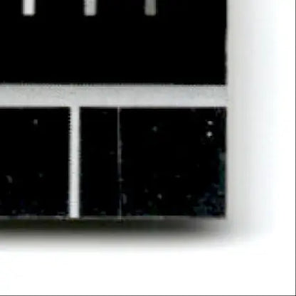 Black and white ruler section with clear markings for donruss football elite Jerry Rice card