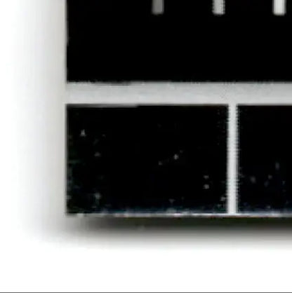 Close-up of donruss football elite Jerry Rice card with metallic sheen and white specks